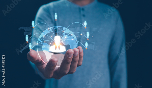 Fototapeta Naklejka Na Ścianę i Meble -  Employing CRM, the businessman manages global customer networks, leveraging technology for data exchanges and development, context of customer service, banking, and strategic business initiatives.