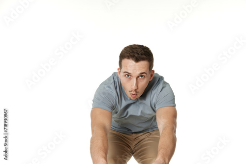 happy guy looking pointing at the camera on white studio background