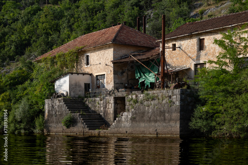 Rijeka Crnojevića, Montenegro - 06 24 2023: Local cabin by the Crnojevića river with a great water view, surrounded by lush green mountains