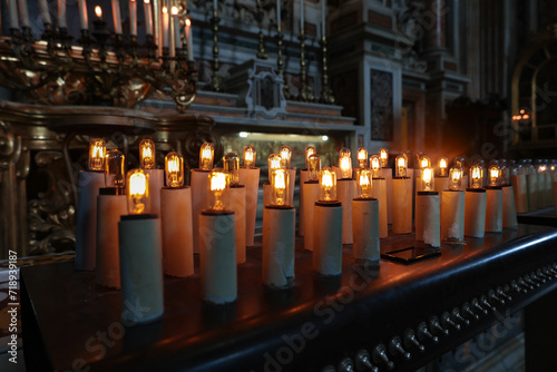 Napoli, Italy - 06 29 2023: Bulb candles of the Gesu Nuovo Church, a 16th-century Neopolitan baroque architecture, know for its very plain facade, yet beautiful interior