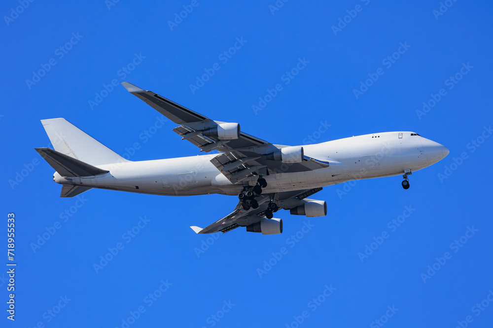 A large aircraft in condition to land on the runway.