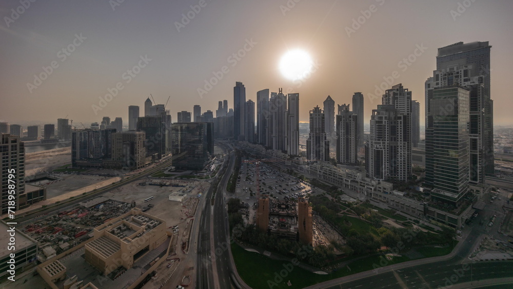 Panorama of Bay Avenue with modern towers residential development in Business Bay aerial all day timelapse