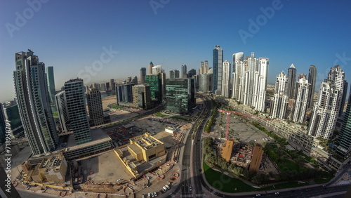 Bay Avenue with modern towers residential development in Business Bay aerial panoramic night to day timelapse, Dubai © neiezhmakov