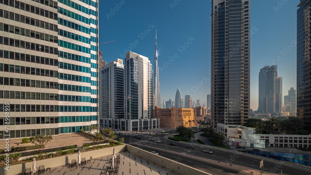 Aerial panoramic view to Dubai downtown and difc skyscrapers night to day timelapse.