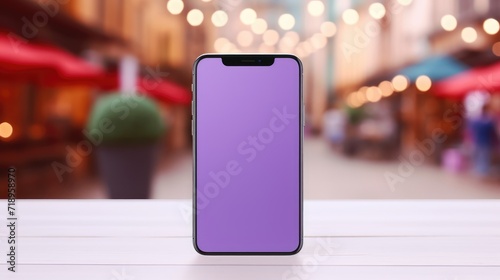 Mockup of a blank phone screen in purple tones on a blurred background