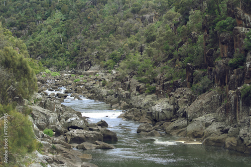 River running through rocky mountain valley