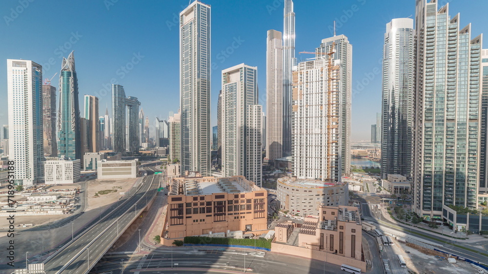 Aerial view of Dubai Downtown skyline with many towers timelapse.