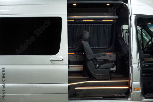 Comfortable interior of a passenger bus with soft seats. The design is made to order. Private covering of cars. Various elements of the bus interior.