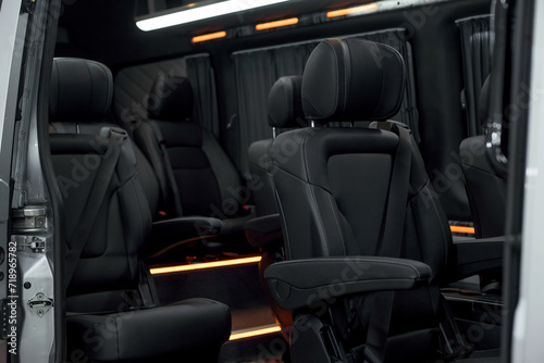 Comfortable interior of a passenger bus with soft seats. The design is made to order. Private covering of cars. Various elements of the bus interior.