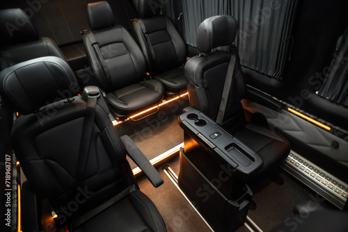 Comfortable interior of a passenger bus with soft seats. The design is made to order. Private covering of cars. Various elements of the bus interior.