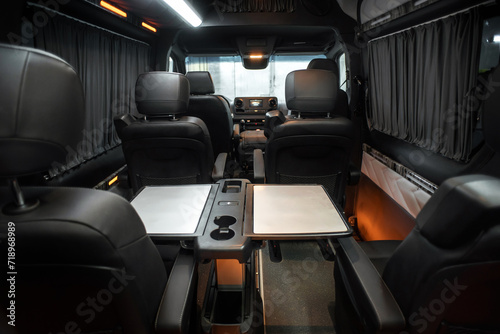 Comfortable interior of a passenger bus with soft seats. The design is made to order. Private covering of cars. Various elements of the bus interior. © Kaminski Vadim