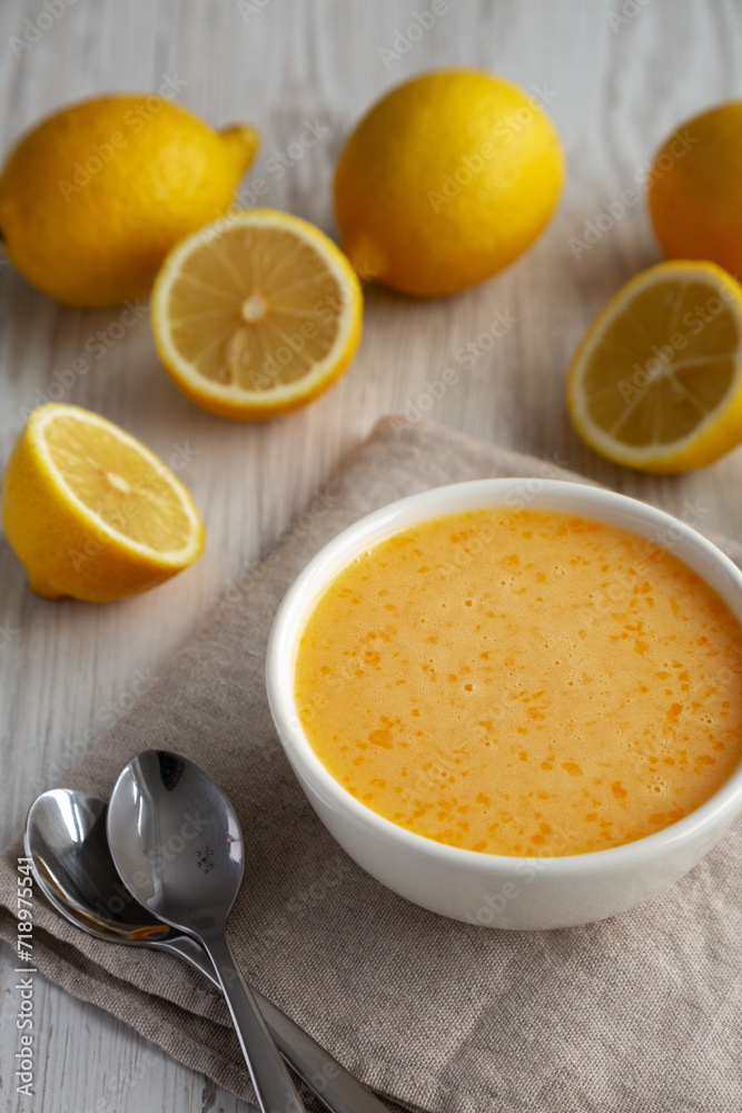 Homemade Organic Lemon Curd in a Bowl, side view. Homemade Organic Lemon Curd in a Bowl, side view.