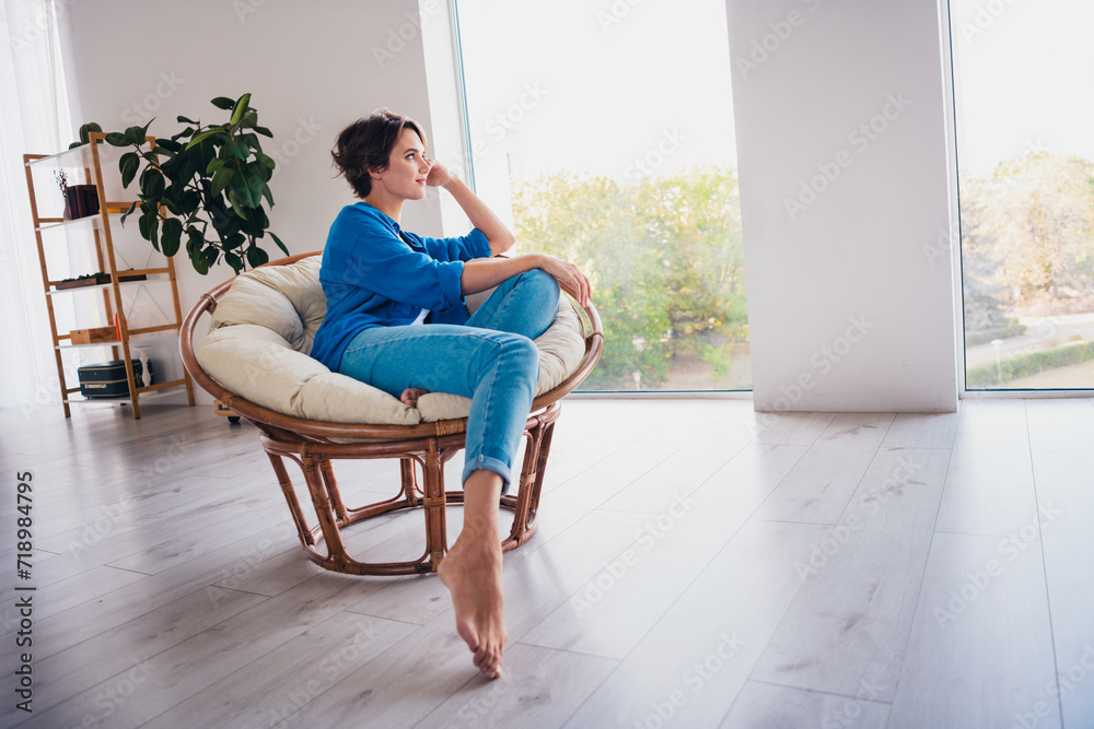 Full length photo of dreamy adorable cute girl indoors looking window sunny weather outside Full length photo of dreamy adorable cute girl indoors looking window sunny weather outside