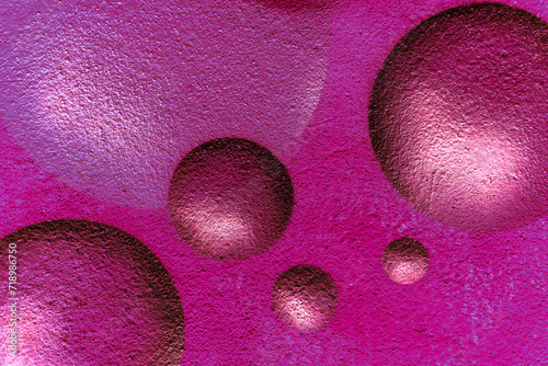 urban street wall aerosol graffiti painting with drawing of colorful round bubbles and balls in space