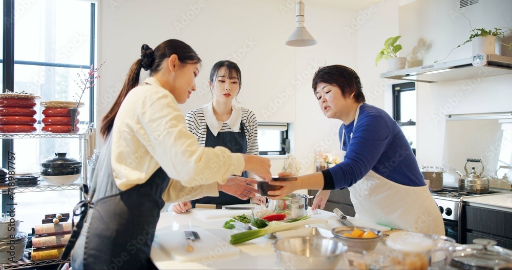 Japan, women and cooking in kitchen with teaching for recipe, Japanese cuisine and healthy meal in restaurant. Chef, people and traditional lunch with learning or instruction for dinner and culture Japan, women and cooking in kitchen with teaching for recipe, Japanese cuisine and healthy meal in restaurant. Chef, people and traditional lunch with learning or instruction for dinner and culture