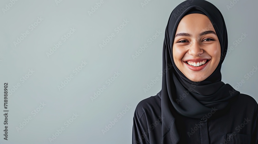 Close-up of a beautiful moslem woman smiling and looking at camera. Oriental beauty, fashion and healthy ideas. Close-up of a beautiful moslem woman smiling and looking at camera. Oriental beauty, fashion and healthy ideas.