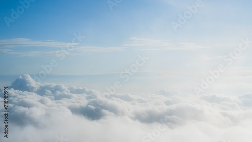 Large white clouds with soft sunlight on clear sky on the plane in morning, Panorama high nature view beautiful white cloudy and blue sky