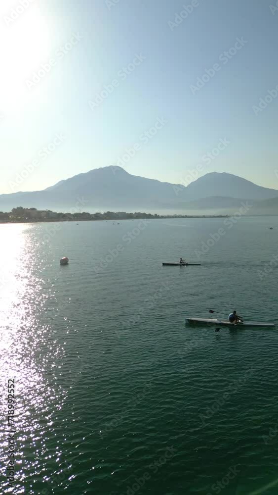Sport Canoe rowing on tranquil water, Aerial view.rowing beach sprint race . High quality 4k footage Sport Canoe rowing on tranquil water, Aerial view.rowing beach sprint race . High quality 4k footage