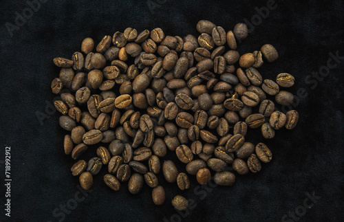 coffee beans on a dark background. top view of coffee beans.