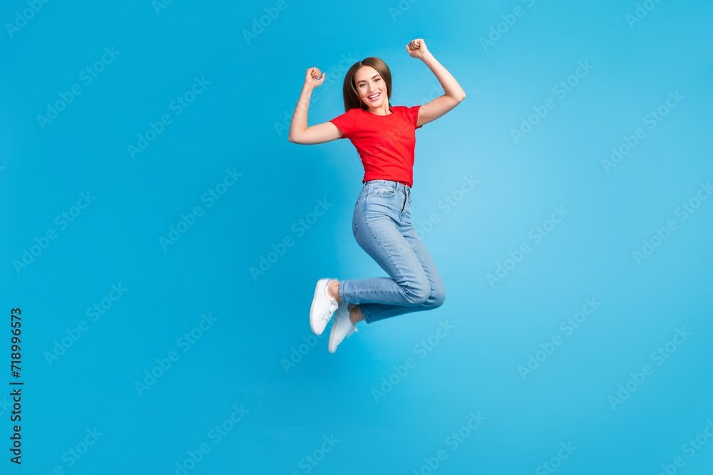 Full length photo of overjoyed cheerful woman dressed stylish clothes rejoice vacation holidays isolated on blue color background Full length photo of overjoyed cheerful woman dressed stylish clothes rejoice vacation holidays isolated on blue color background