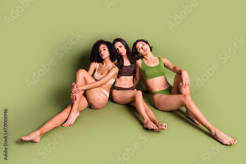 Full length top view studio photo of cute adorable women wear lingerie cuddling enjoying loving themselves isolated pastel khaki color background