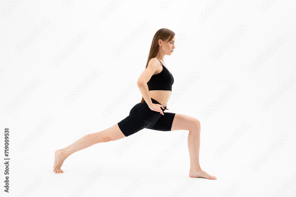 Beautiful girl in sportswear doing yoga