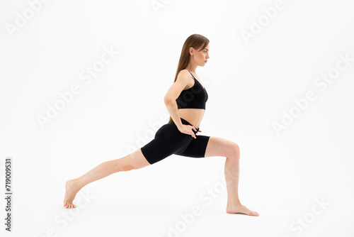 Beautiful girl in sportswear doing yoga