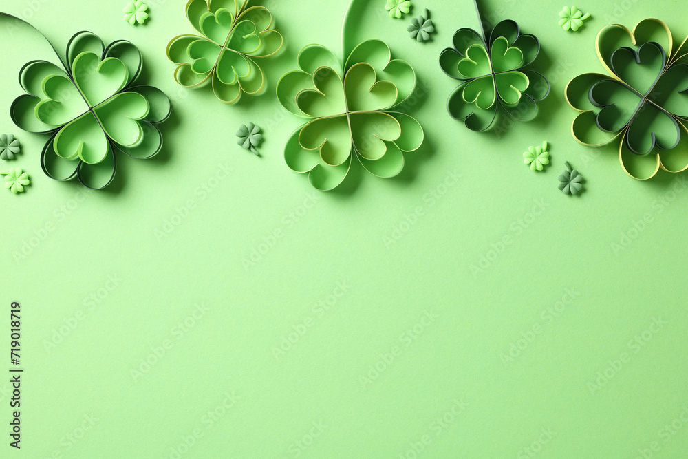 Lucky four-leaf clover on green background. Paper art and craft style. St Patrick's Day concept. Lucky four-leaf clover on green background. Paper art and craft style. St Patrick's Day concept.