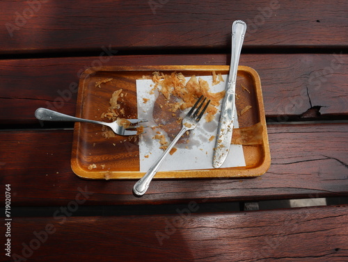 Empty dish with knife and fork after lunch