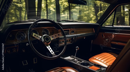 A photo captured from the middle of the back seat of a modern passenger car, showcasing the interior features such as steering wheel, gear shift, front windshield and dashboard © Ziyan
