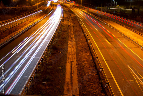 Trail of lights left by car headlights on a road at night © SaucE ReQuEs