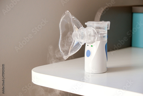 Oxygen mask of nebulizer with steam, medical equipment for pneumonia, covid, sars and bronchitis treatment. Inhaler, respiratory pulmonary disease, child allergy