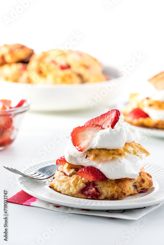 A serving of light and fresh strawberry shortcake, ready for eating.