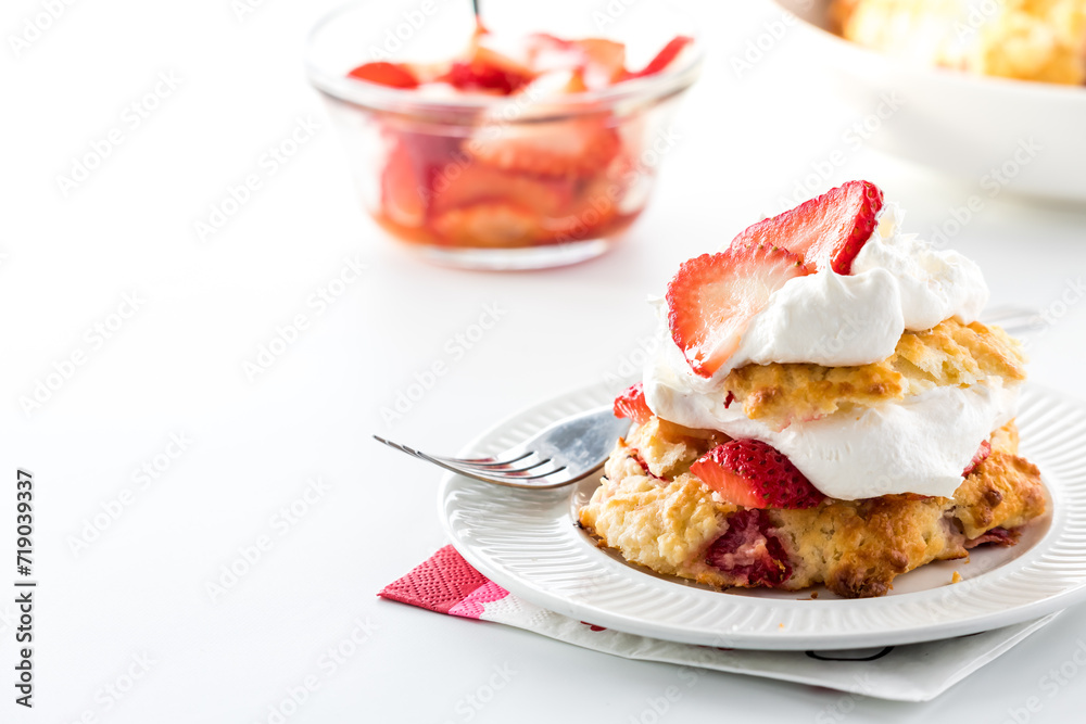 Fresh strawberry shortcakes, against a bright background. Fresh strawberry shortcakes, against a bright background.