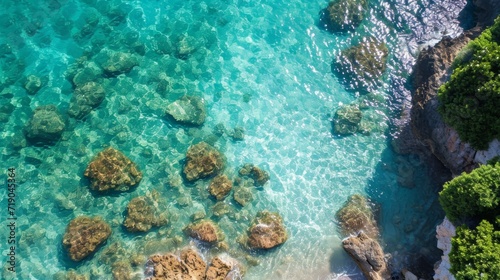 Experience the tranquil beauty of a turquoise reef, where aqua waves crash against coral rocks in this stunning outdoor oasis