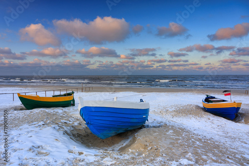 Fototapeta Naklejka Na Ścianę i Meble -  Fishing boats on the Baltic Sea beach in Jantar at winter. Poland