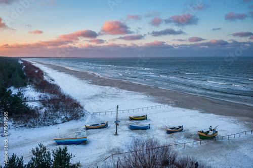 Fototapeta Naklejka Na Ścianę i Meble -  Fishing boats on the Baltic Sea beach in Jantar at winter. Poland