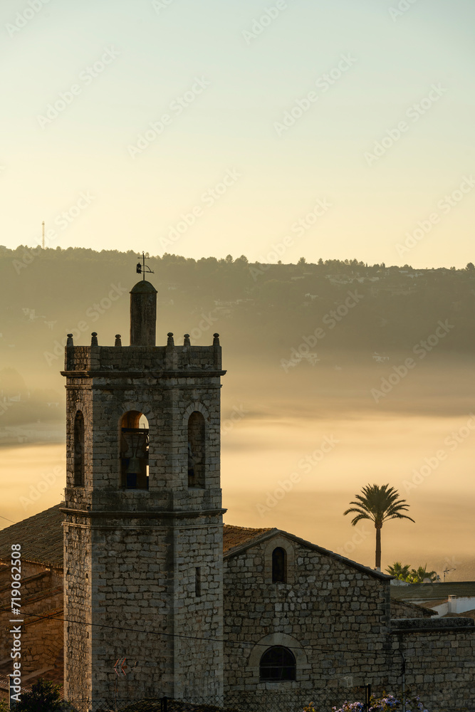 Church tower and village building at Lliber, Costa Blanca, Marina Alta, Alicante province, Spain - stock photo