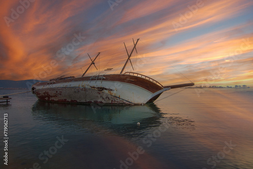 Fototapeta Naklejka Na Ścianę i Meble -  Sunked yacht during sunset in Didim