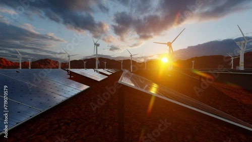 Sunset and solar energy technology panels and wind mills