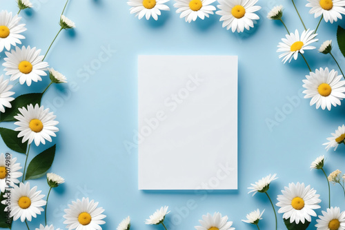 Blank paper sheet card with mockup copy space on light blue and white flowers © Giuseppe Cammino
