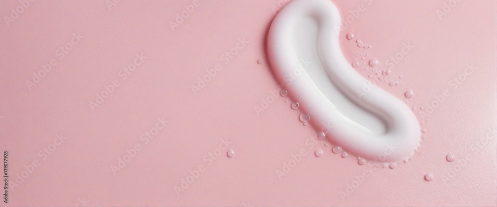 Pink pastel background with white foam bubbles ideal for laundry and cleaning services