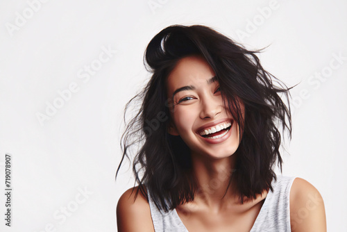 Portrait of a beautiful asian woman laughing, isolated on a white background