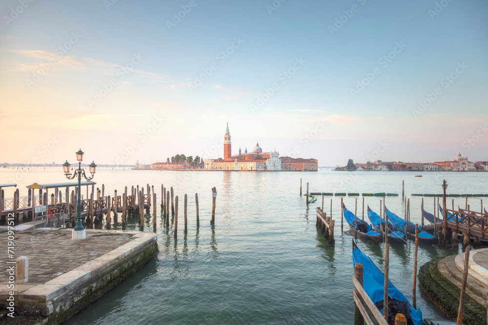 Venice, San Giorgio Maggiore church and gondolas at sunrise. Italy