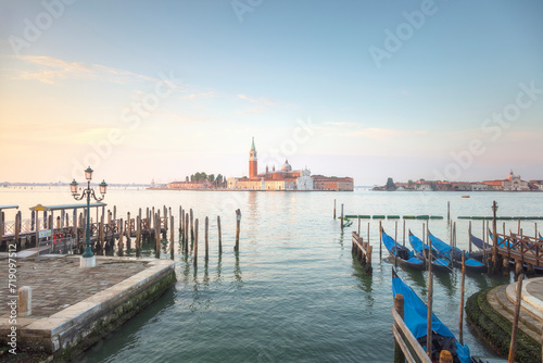 Venice, San Giorgio Maggiore church and gondolas at sunrise. Italy