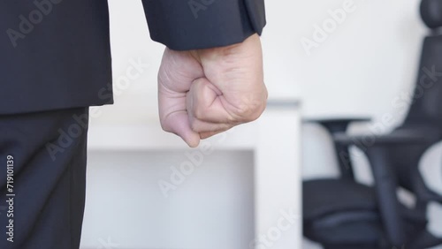Closeup of hand of angry, frustrated and stress businessman in a work office.Corporate employee upset, furious and conflict while feeling violence, anger or fight at a workplace after conflict at work