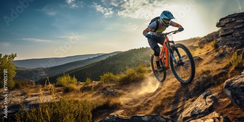 Mountain biker cyclist riding a bicycle downhill on a mountain bike trail. Outdoor recreational lifestyle adventure sport activity in nature