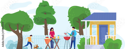 Fototapeta Naklejka Na Ścianę i Meble -  Family enjoying a backyard barbecue near their home, a man grilling, woman at table. Boy and dog playing, sunny outdoor setting for leisure and fun.