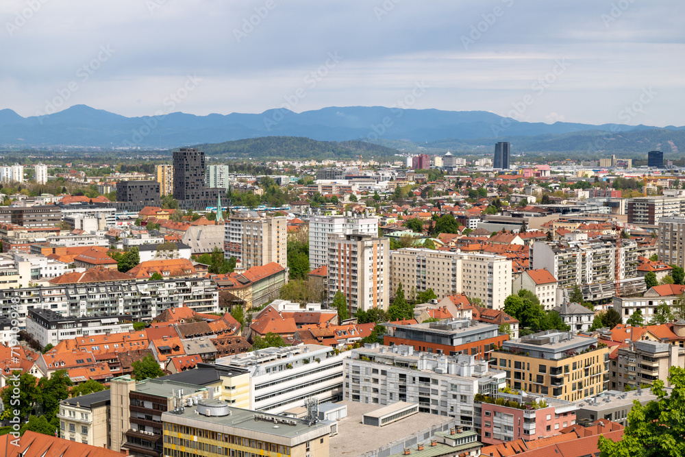 Beautiful views of the city of Ljubljana and the snow-capped mountains of the Julian Alps in the background. From above the Ljubljana castle, Ljubljanski grad, Slovenia.