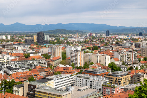 Beautiful views of the city of Ljubljana and the snow-capped mountains of the Julian Alps in the background. From above the Ljubljana castle, Ljubljanski grad, Slovenia. photo